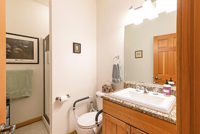 406 Back Nine Ln, Hamilton, MT 59840 - full bath with toilet, tile patterned flooring, a shower with shower door, and vanity