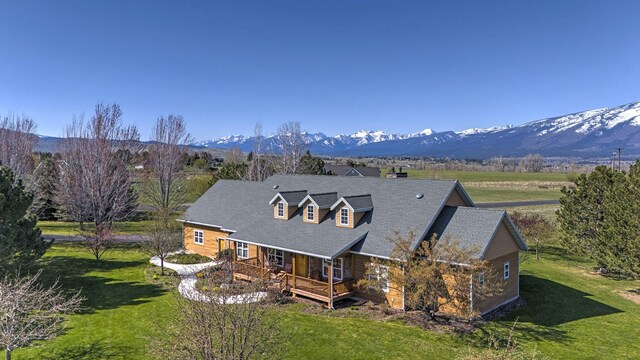 406 Back Nine Ln, Hamilton, MT 59840 - rear view of house featuring a mountain view, a chimney, and a lawn