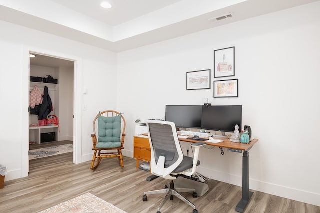 office space with baseboards, recessed lighting, visible vents, and wood finished floors