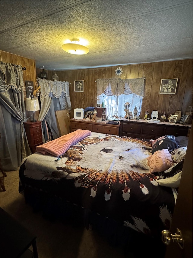 bedroom featuring wooden walls
