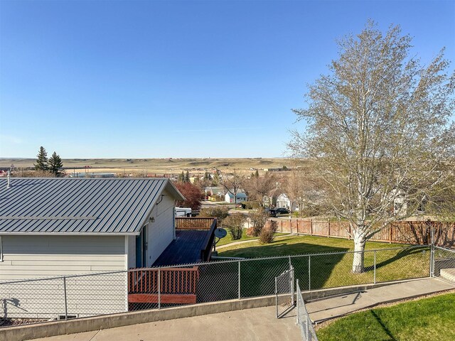 101 11th Ave N, Shelby, MT 59474 - exterior space featuring metal roof, fence, and a front lawn