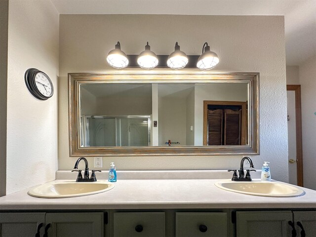 101 11th Ave N, Shelby, MT 59474 - full bath with double vanity, a shower with door, and a sink