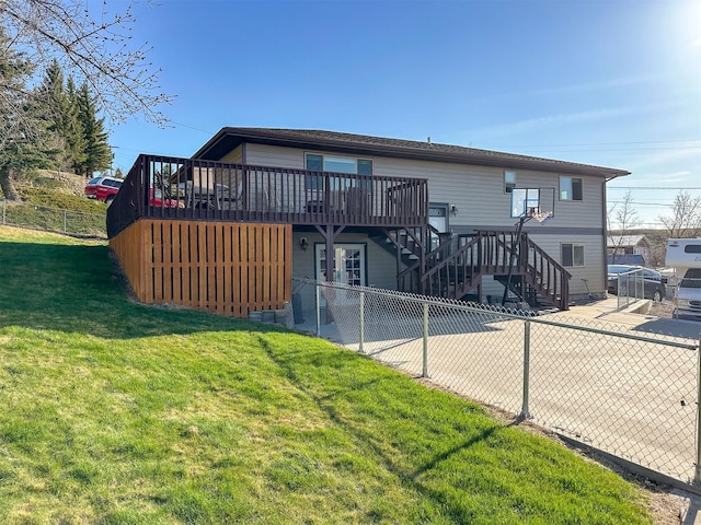 101 11th Ave N, Shelby, MT 59474 - rear view of property featuring a lawn, stairway, fence, and a wooden deck