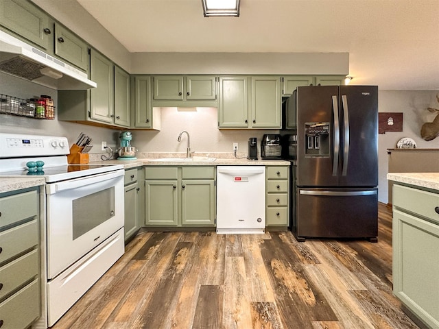 101 11th Ave N, Shelby, MT 59474 - kitchen with under cabinet range hood, green cabinets, a sink, and white appliances