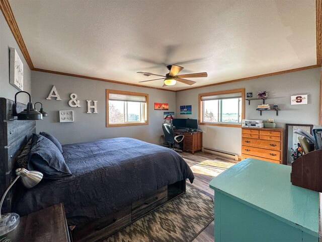 101 11th Ave N, Shelby, MT 59474 - bedroom with a baseboard heating unit, ornamental molding, a textured ceiling, ceiling fan, and light wood-style flooring