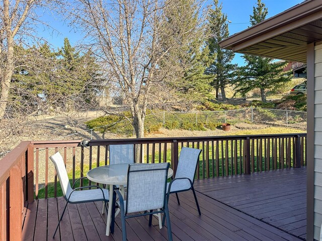 101 11th Ave N, Shelby, MT 59474 - wooden deck featuring fence and outdoor dining area