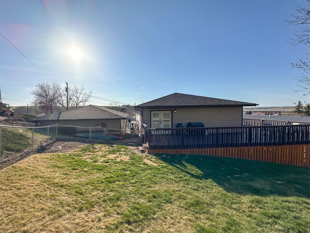 101 11th Ave N, Shelby, MT 59474 - back of house with a yard, a deck, a fenced backyard, and a gate