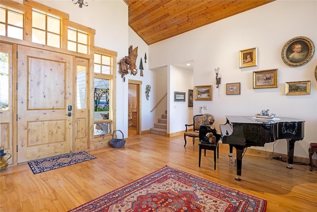 34426 Ridge Rd, Polson, MT 59860 - entryway featuring wood finished floors, stairway, high vaulted ceiling, baseboards, and wooden ceiling