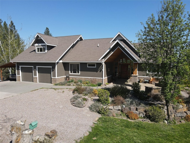 34426 Ridge Rd, Polson, MT 59860 - craftsman-style home featuring stone siding, concrete driveway, a garage, and a carport