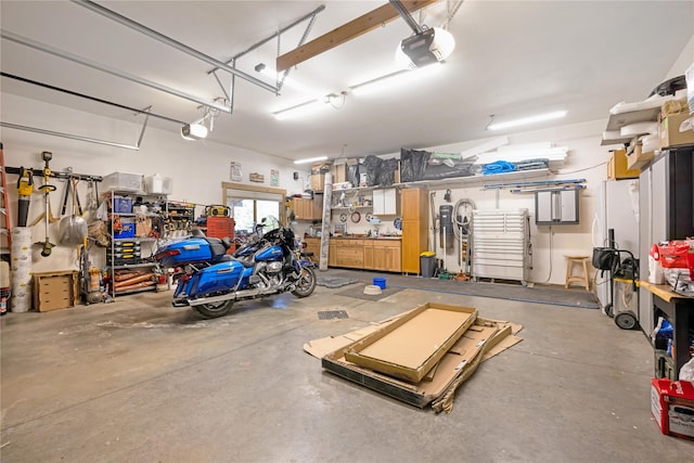 34426 Ridge Rd, Polson, MT 59860 - garage with a garage door opener and a workshop area