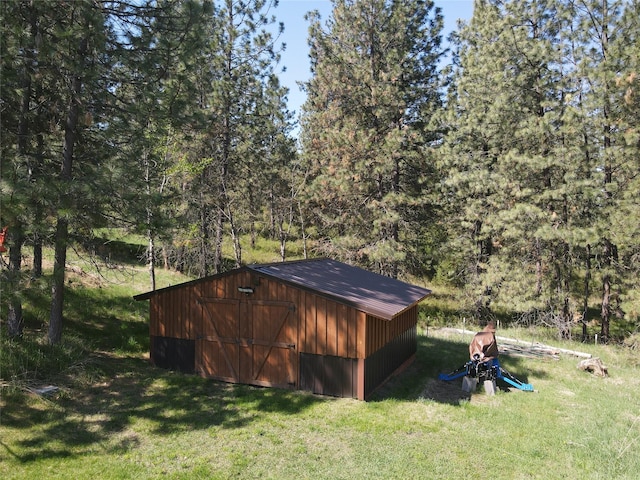 34426 Ridge Rd, Polson, MT 59860 - view of outbuilding featuring a view of trees