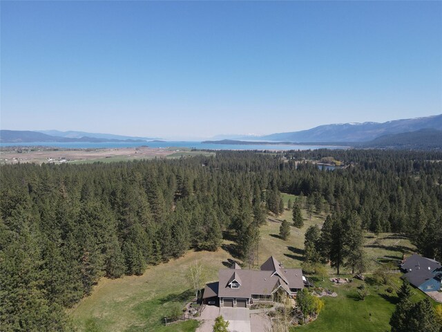 34426 Ridge Rd, Polson, MT 59860 - aerial view of property's location featuring a forest and a mountainous background