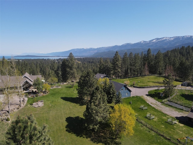 34426 Ridge Rd, Polson, MT 59860 - aerial overview of property's location featuring a heavily wooded area and a mountain backdrop