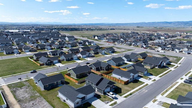 aerial view with a mountain view and a residential view