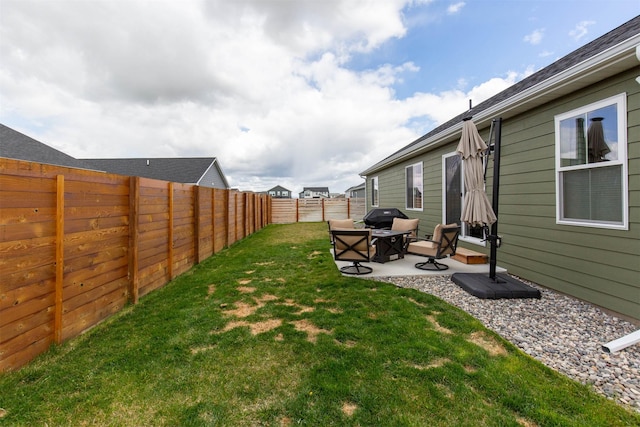 view of yard with a patio area and a fenced backyard