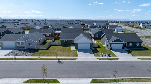 birds eye view of property with a residential view