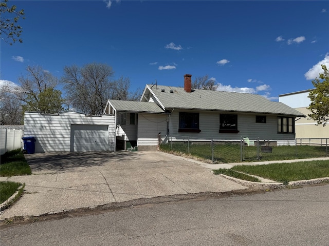 ranch-style home featuring an attached garage, concrete driveway, a chimney, and fence