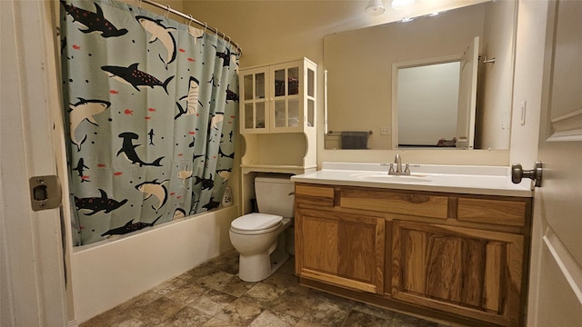 full bathroom featuring toilet, vanity, and shower / bath combo with shower curtain