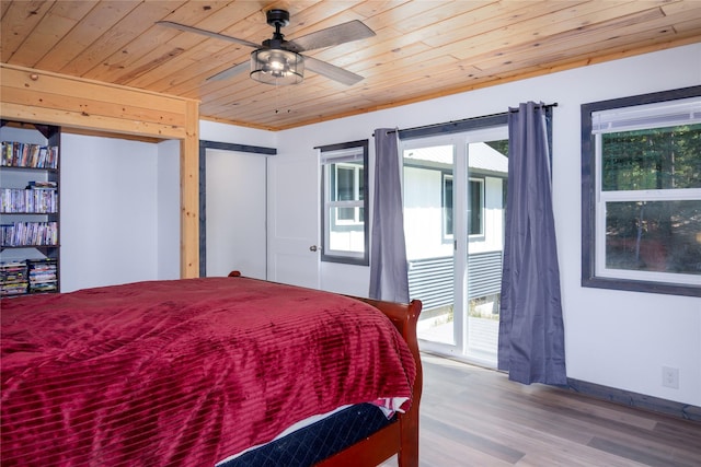 bedroom featuring wooden ceiling, access to outside, and wood finished floors