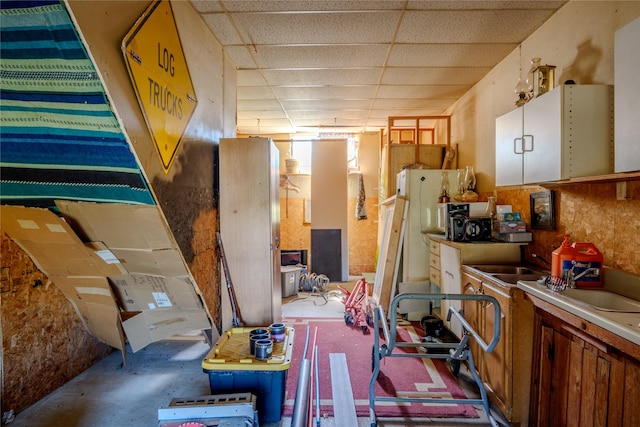 kitchen featuring a drop ceiling