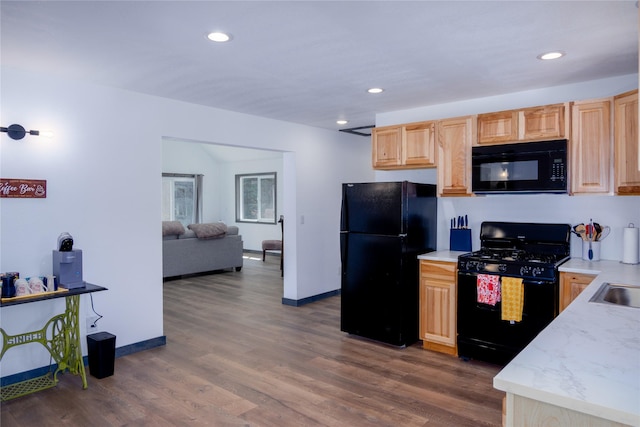kitchen featuring black appliances, light brown cabinetry, recessed lighting, and dark wood-style flooring