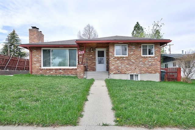 412 Raymond St, Helena, MT 59601 - view of front of house with a chimney and brick siding