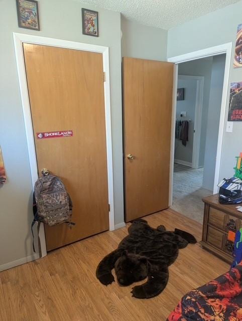 412 Raymond St, Helena, MT 59601 - bedroom featuring wood finished floors and a textured ceiling