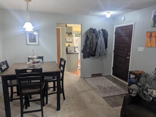 412 Raymond St, Helena, MT 59601 - dining space featuring a textured ceiling and carpet