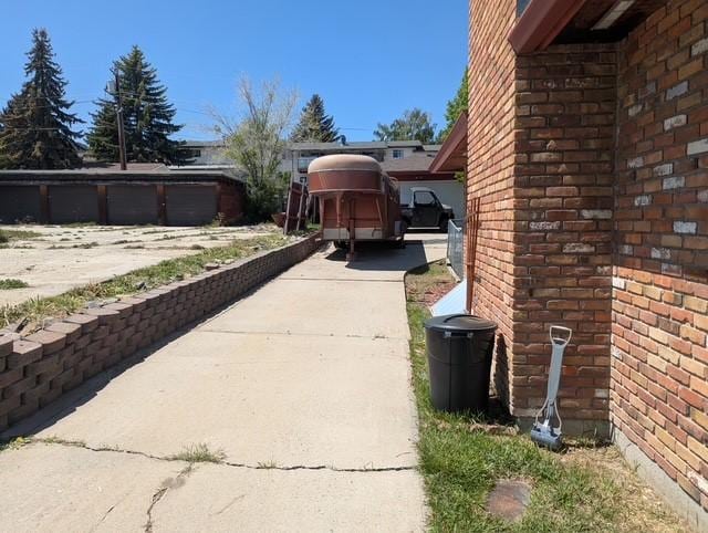 412 Raymond St, Helena, MT 59601 - view of side of home with driveway and brick siding