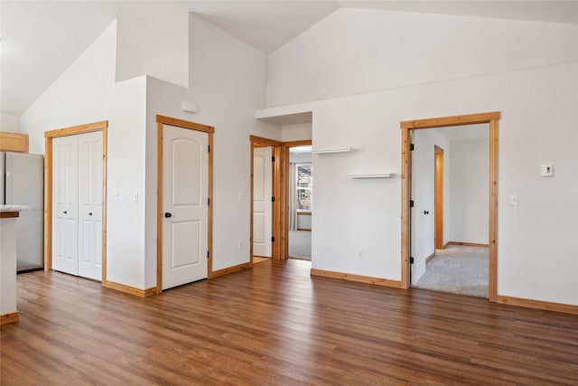 3010 Tina Ave Unit 306, Missoula, MT 59808 - unfurnished living room with wood finished floors and high vaulted ceiling