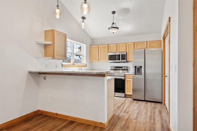 3010 Tina Ave Unit 306, Missoula, MT 59808 - kitchen featuring stainless steel appliances, light brown cabinetry, open shelves, vaulted ceiling, and light wood-type flooring