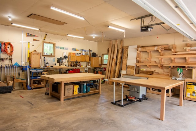 garage featuring a workshop area and a garage door opener