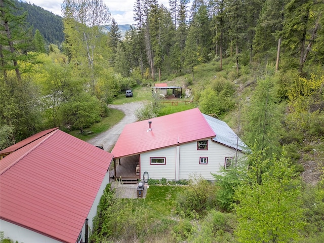 view from above of property featuring a forest