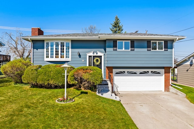 bi-level home featuring brick siding, driveway, a garage, a front yard, and a chimney