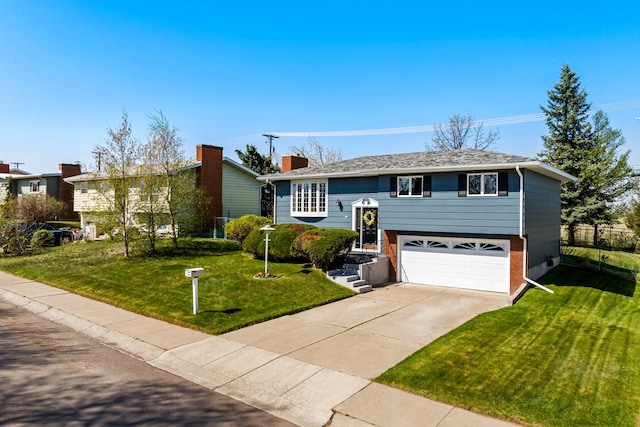 raised ranch with concrete driveway, brick siding, a front lawn, and a garage