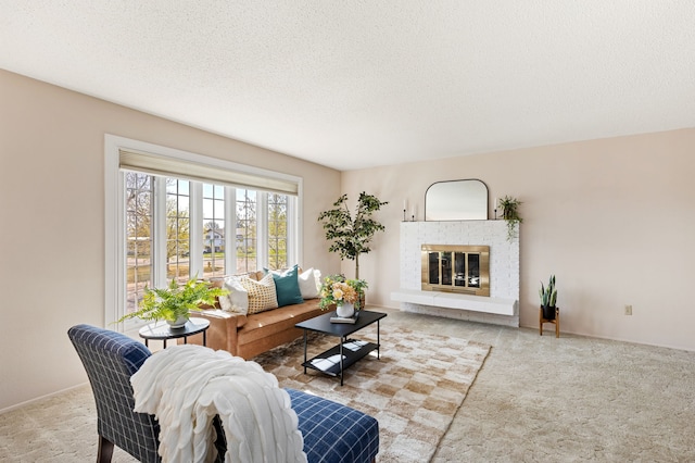 carpeted living area with a textured ceiling and a brick fireplace