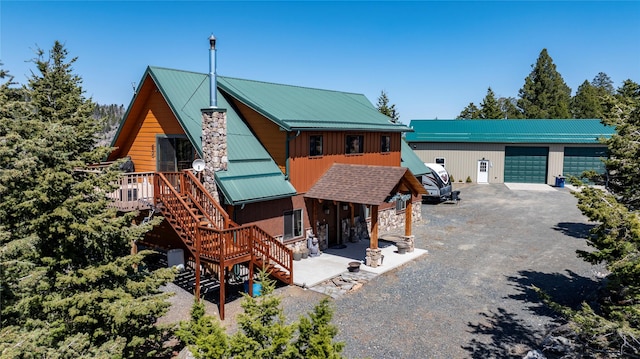 45 Bay Rd, Whitehall, MT 59759 - rustic home with driveway, stairway, a chimney, and metal roof