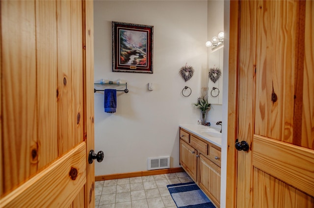 45 Bay Rd, Whitehall, MT 59759 - bathroom featuring baseboards, tile patterned flooring, vanity, and visible vents
