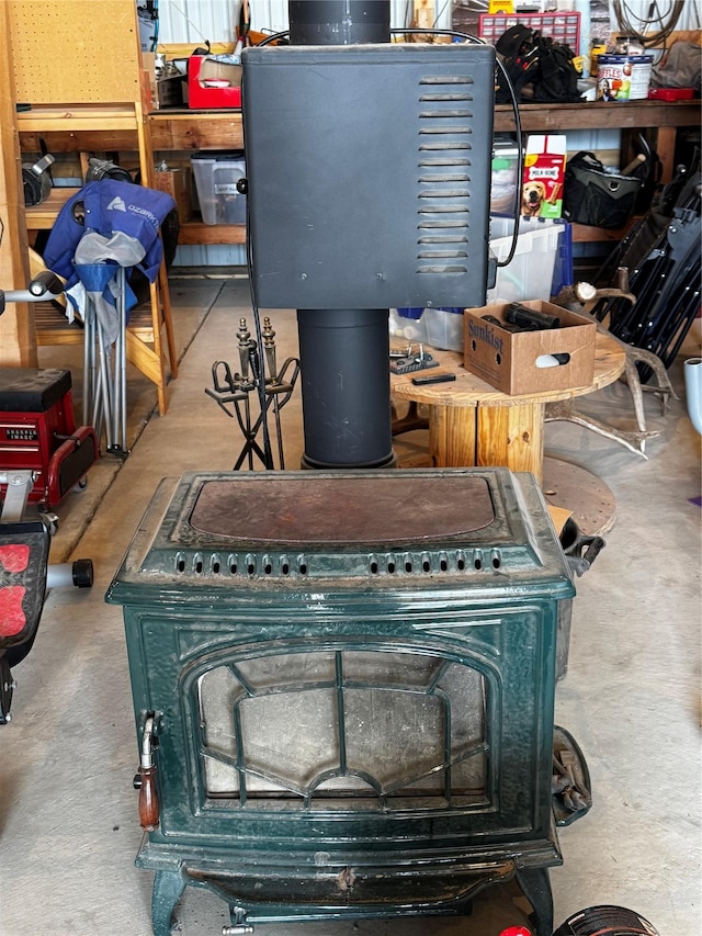 45 Bay Rd, Whitehall, MT 59759 - interior space featuring a wood stove and concrete flooring