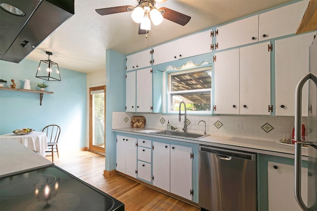 kitchen featuring a sink, light wood-type flooring, decorative backsplash, electric range, and stainless steel dishwasher