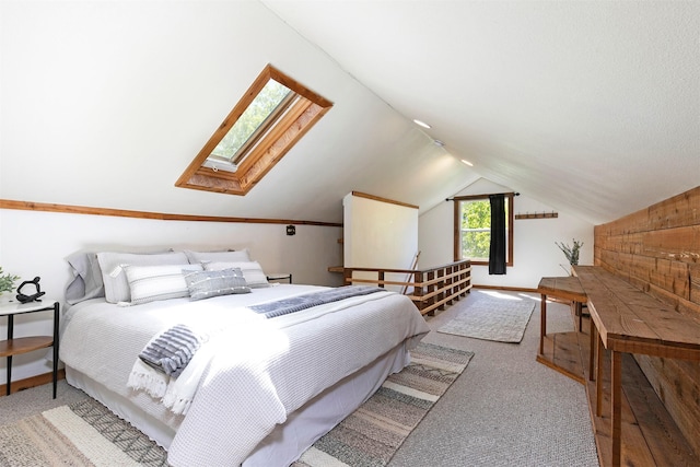 bedroom with carpet and lofted ceiling with skylight