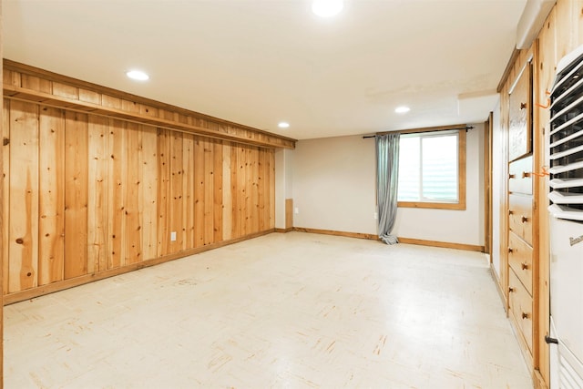 basement featuring baseboards and recessed lighting
