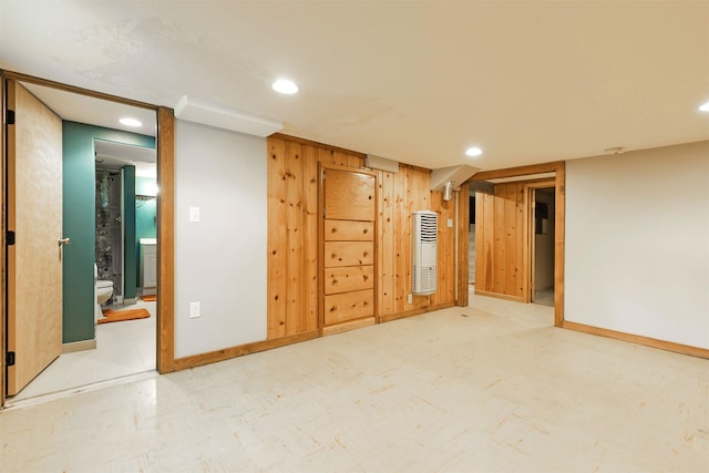 empty room with baseboards and recessed lighting