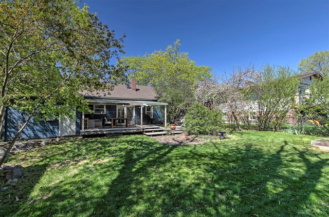 view of yard with a wooden deck
