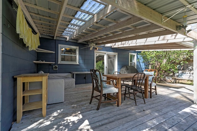 deck featuring ceiling fan and outdoor dining area