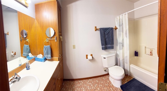 105 Garden Dr Unit D, Kalispell, MT 59901 - full bathroom featuring vanity, toilet, baseboards, and shower / bath combo with shower curtain