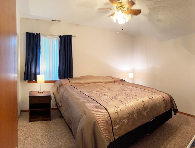105 Garden Dr Unit D, Kalispell, MT 59901 - carpeted bedroom with visible vents, baseboards, and ceiling fan
