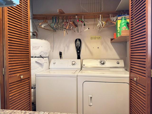 105 Garden Dr Unit D, Kalispell, MT 59901 - laundry room featuring washing machine and clothes dryer and laundry area
