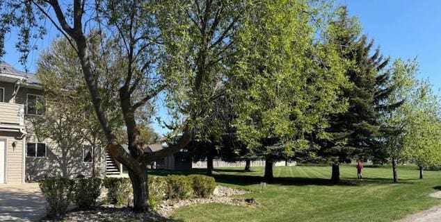 105 Garden Dr Unit D, Kalispell, MT 59901 - view of home's community with a lawn and driveway