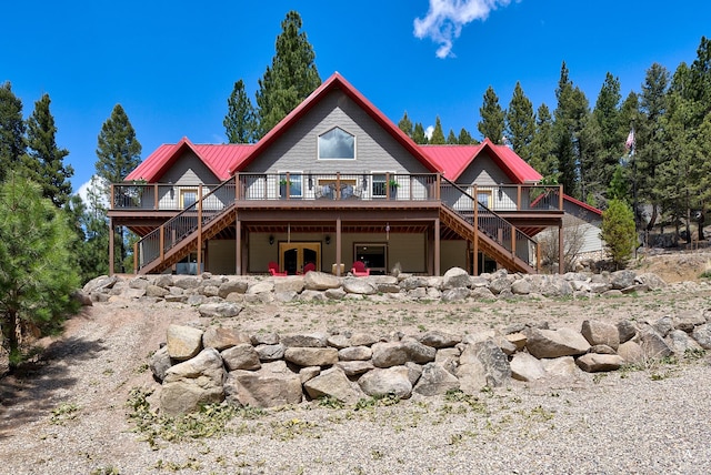 617 Mcclellan Creek Rd, Clancy, MT 59634 - rear view of property with stairs, a deck, and a metal roof